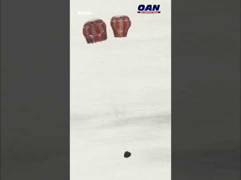 NASA: Orion's main parachute has deployed as the Artemis II crew splashes down to earth.