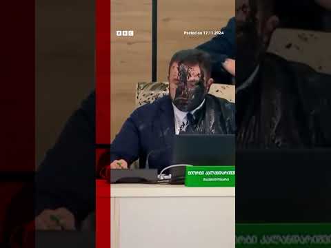 Moment Georgia election chief doused in paint by opposition official. #Georgia #BBCNews